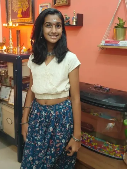 Here is a beautiful example of how my clothes grow with your child. This young lady is wearing our floral skirt with a simple white top, showing how versatile these pieces can be.