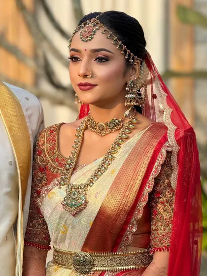 A close-up of the bride's radiant makeup. The look is fresh and dewy, perfect for a daytime wedding ceremony, and designed to last all day.
