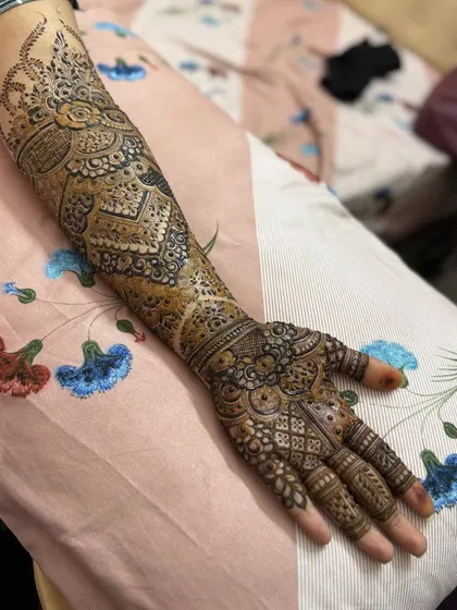 This is a detailed view of my intricate bridal henna work. Each design is unique, combining traditional patterns like paisleys and mandalas with fine-line fillers to create a stunning, full-coverage look for your special day.