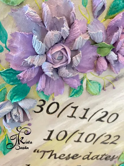 A quote board is a wonderful way to keep inspiration in sight. This piece features amethyst-colored hybrid flowers alongside important dates, making it a beautiful and meaningful piece of decor.