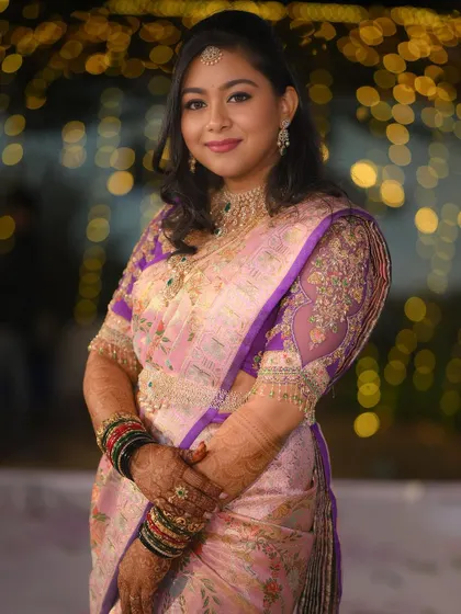 A beautiful outdoor shot of the bride, the bokeh background making her stand out.