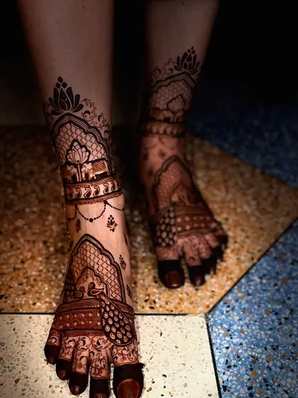 A beautiful bridal leg design with lotus and elephant motifs, creating a traditional and auspicious look.