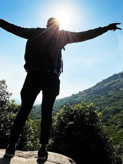 That feeling of reaching the peak just as the sun breaks through. This moment from our Skandagiri trek captures the pure joy and accomplishment that comes with an early morning climb.