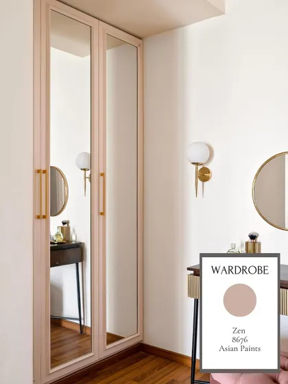 For the wardrobe, we chose 'Zen' by Asian Paints, a dusty rose color that adds a touch of warmth and femininity to the dressing area.