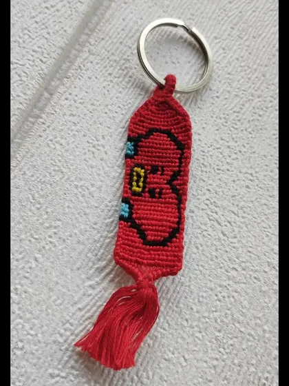 For the BTS ARMY, here is a BT21 Tata keychain. This knotted charm captures V's adorable heart-headed character perfectly.