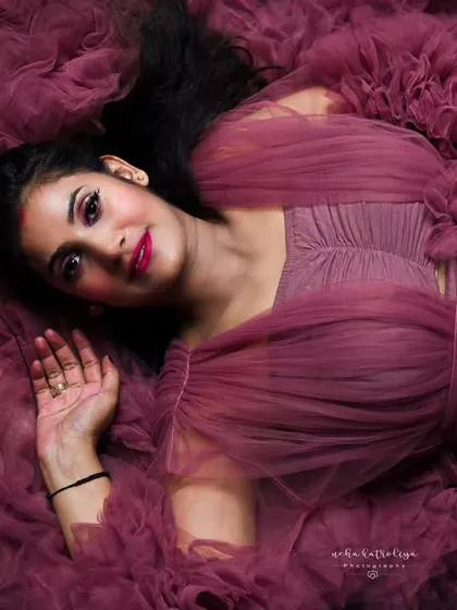 Lying in a bed of ruffled tulle, this overhead shot is pure art. It creates a soft, dreamy texture that is both unique and incredibly beautiful.