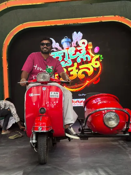 Another shot with the red scooter used for the grand launch of 'Kwatle Kitchen' on Colors Kannada.