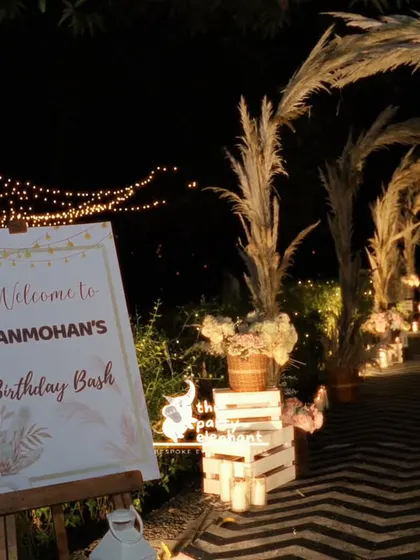 Another beautiful view of the entrance walkway, showing how the combination of lighting, natural elements, and custom signage created a truly special arrival experience.