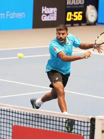 A backhand slice, a versatile shot used for both defense and attack.