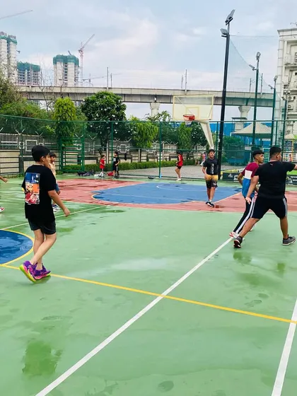 A player dribbles past a defender on the glistening court.
