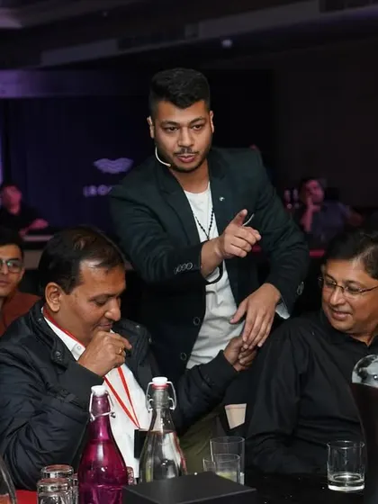 Performing strolling magic for guests at a corporate event for Lixil. I move from table to table, ensuring everyone gets a front-row seat to the impossible.
