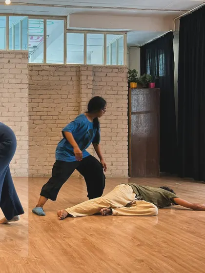 A moment of connection and support during an improvisation exercise. We learn to give and take weight, both physically and emotionally.