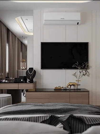 This bedroom view highlights a multi-functional unit that combines a TV console with a dressing table. It's a smart solution for keeping a bedroom organized and stylish.