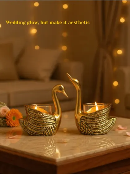 Add a touch of aesthetic wedding glow with these elegant swan T-light holders. Crafted in brass, they bring a sense of romance and grace to any tabletop or decor arrangement for your special day.