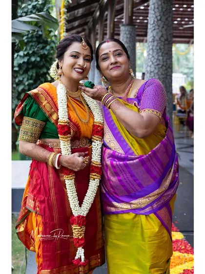 Ashwini with her mother on her wedding day. We provided a full makeover for her mom, including makeup and a traditional Iyer Madisar saree drape.