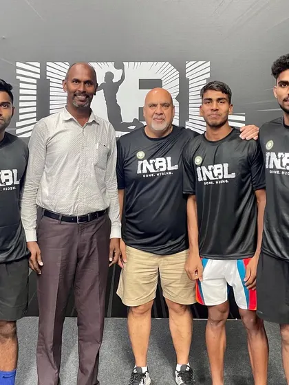 With officials and teammates at the INBL 3x3 event.