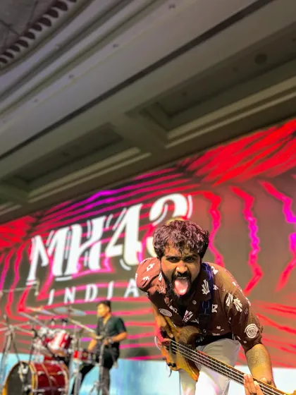 A little bit of fun and madness on stage is our signature. Our bassist showing his playful side during the Saraswat Bank annual conference.