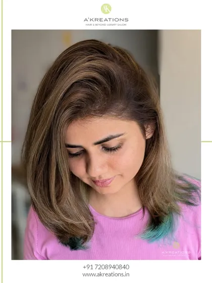 Understated elegance with a twist. We created these mushroom blonde highlights with a pastel sea green peekaboo for a touch of magic.