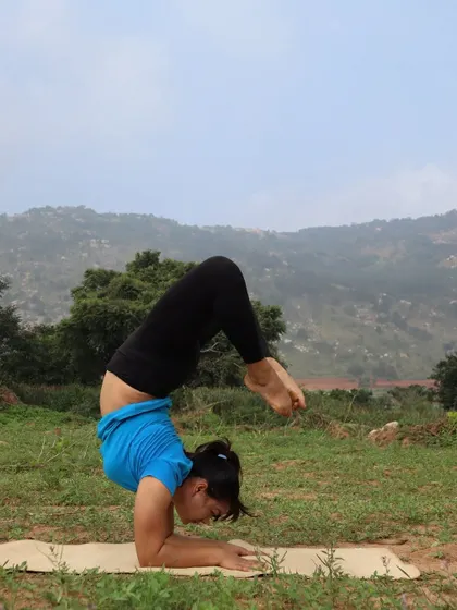 Fitness is not about being lean; it's about how your body functions. Here I am in a scorpion pose variation, demonstrating the strength and mobility that comes from a consistent practice, regardless of body type.