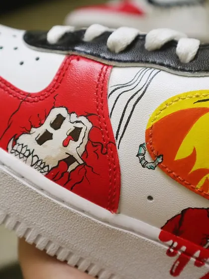 For the NFT and crypto art fans. I painted a flaming zombie from the Mutant Ape Yacht Club (MAYC) collection onto these Nike AF1s, complete with a bold, comic-book aesthetic and dripping red paint effects.