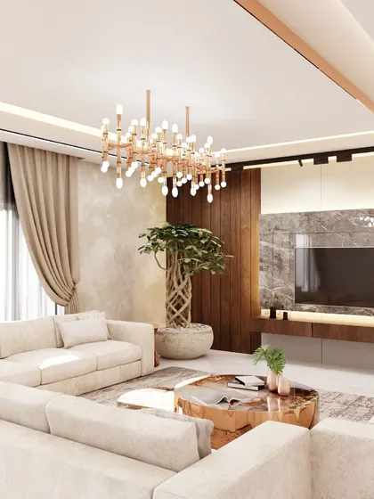 This living room design combines modern aesthetics with classic charm. A premium marble-look laminate TV wall, a cozy L-shaped sofa, and a statement chandelier come together to create a stunning and inviting space.