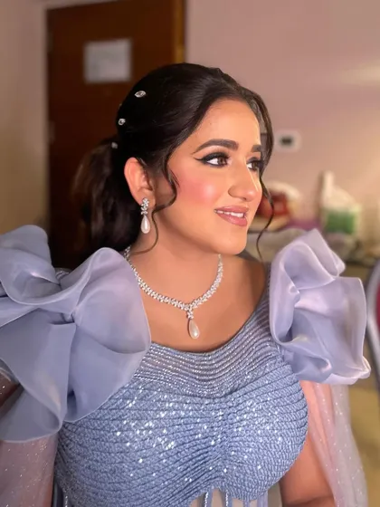 A close-up of the pastel glam, highlighting the shimmery eye and the radiant, flawless skin.