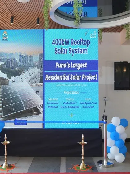 The inauguration ceremony of Pune's largest residential solar project at Infinity Cooperative Housing Society, a 400kW system.