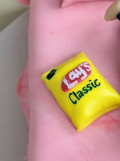 A miniature, puffy bag of Lay's Classic chips, completely edible and made from fondant. This is a great example of how I can recreate everyday objects in sugar.