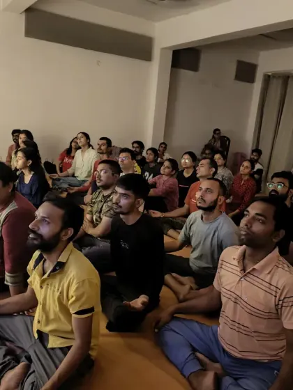 The community meditating together. The collective stillness creates a powerful atmosphere that supports each individual's practice.