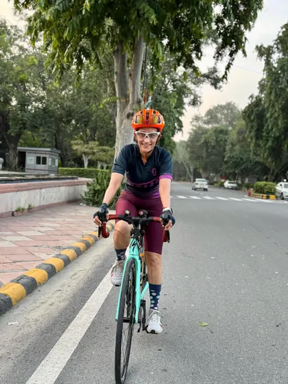 Riding with a smile. The happiness of cycling is evident on her face.