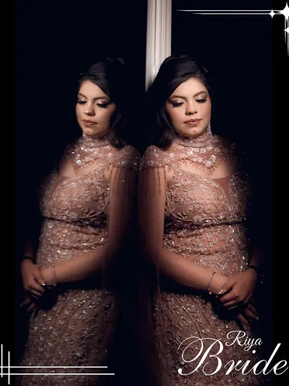An artistic portrait of the bride, Riya, using reflections to create a dramatic and elegant image.