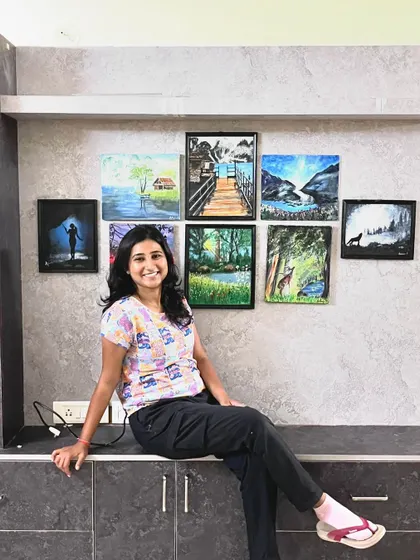 Sitting with my art. These pieces are a constant reminder of my creative journey.
