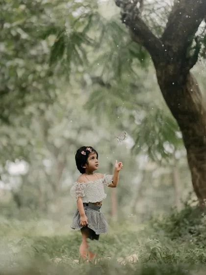 A moment of wonder as she looks up at something that has caught her eye in the forest.