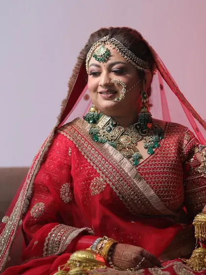 A portrait of the bride, her heavy temple jewellery perfectly complementing her traditional look.