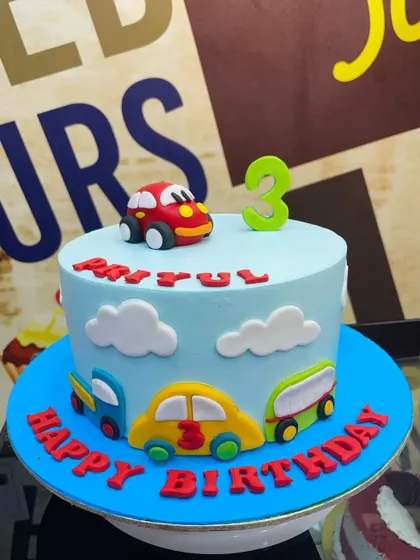 A simple and cute 1.5kg toy car cake, perfect for a toddler's birthday.
