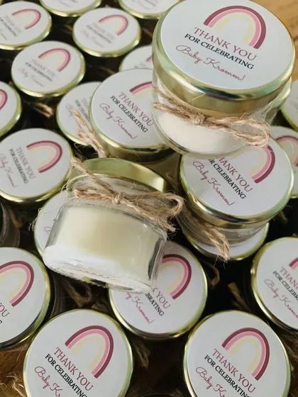 A closer look at the "Thank You for celebrating Baby Kromm!" favors, tied with rustic jute string.