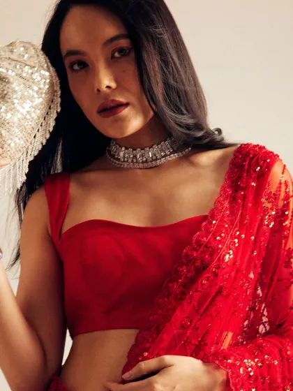 A bold and beautiful look featuring a classic red saree. I paired it with a strong red lip, clean eye makeup, and simple open hair to create a powerful and elegant statement.