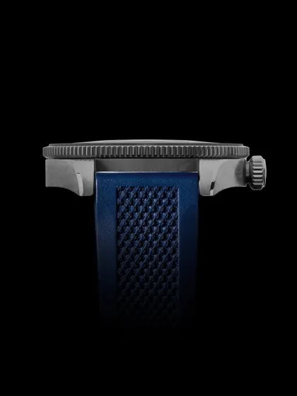 A clean, side-profile shot of the watch against a black background, highlighting its thickness and the texture of the strap.