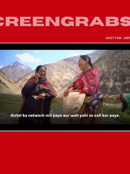 Two women in the village share a happy moment over a phone call, a powerful visual from the Airtel brand film. This shot encapsulates the campaign's core message of connection.