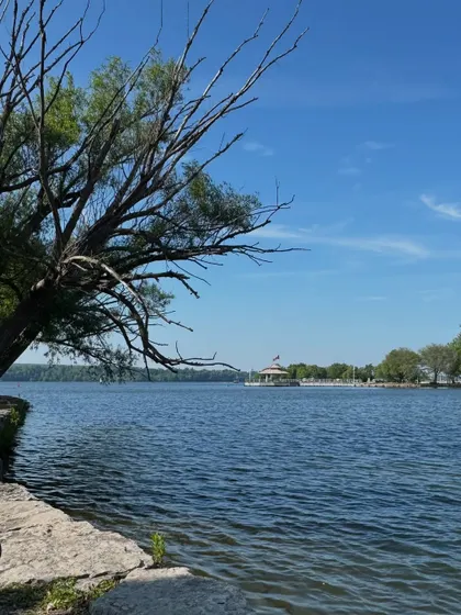 A scenic view of a lakeside park in Ontario on a bright summer day.