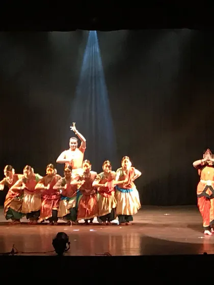 A striking formation from 'Akhandalaya'. The choreography in this piece is designed to create strong visual lines and convey a sense of collective energy and power.