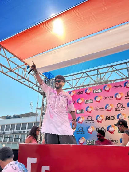 Hosting a Holi event with the Indian tricolor in the background. I use my platform to spread messages of cultural pride and respect.