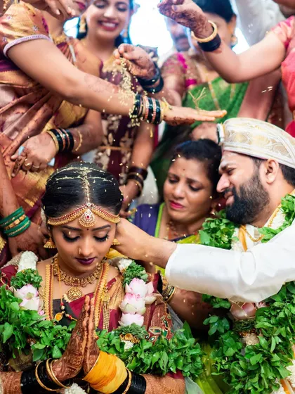 A sacred moment as the couple receives blessings from their families during the wedding ceremony.