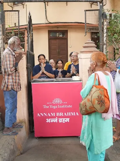 People gather with gratitude at our Annam Brahma distribution point. Together, we can spread care, kindness, and compassion.
