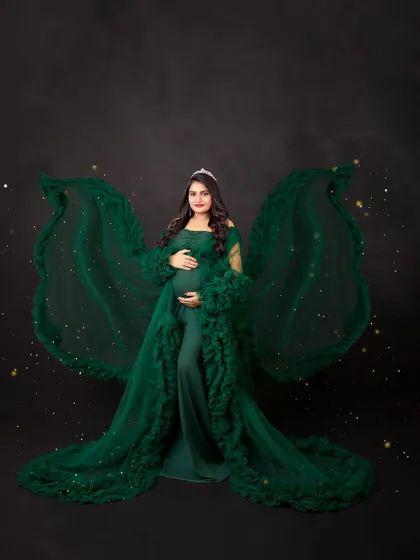 This emerald green gown with sparkling fabric wings is another of my favorite fantasy-inspired looks. It creates a portrait that is both enchanting and powerful.