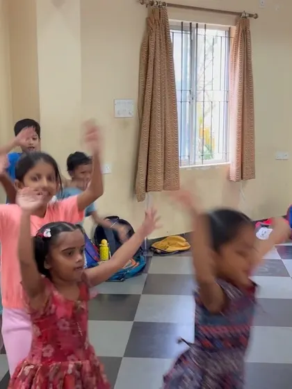 Children engaged in an energetic dance rehearsal, their movements filled with joy and freedom. Our classes encourage creative expression over perfect technique, especially for younger participants.