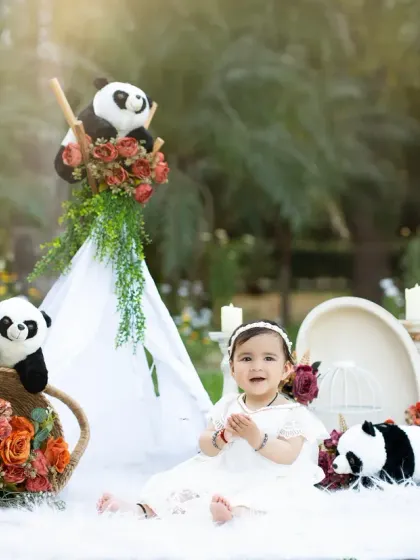 An outdoor-themed toddler session in the studio, featuring a teepee and panda friends. This setup creates a sense of adventure and imaginative play.