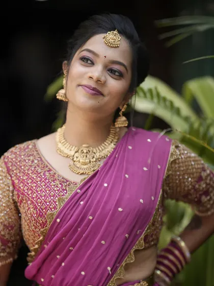 A thoughtful portrait of Teju. This angle showcases her elegant updo and the beautiful details of her makeup.