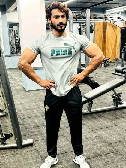 Always be happy. A relaxed pose in the gym, enjoying the fitness lifestyle.