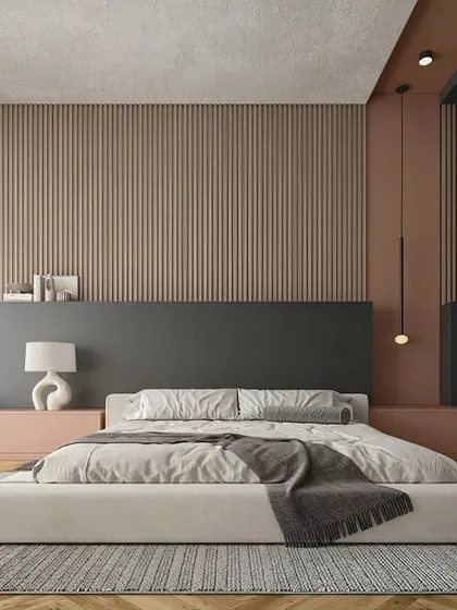 I used a combination of textures in this bedroom to create a calming, earthy feel. The fluted wood paneling behind the low-profile bed, paired with a muted color palette, results in a minimalist yet warm and inviting sanctuary.